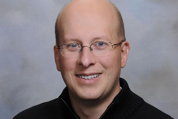 Professional headshot of David Herrin.